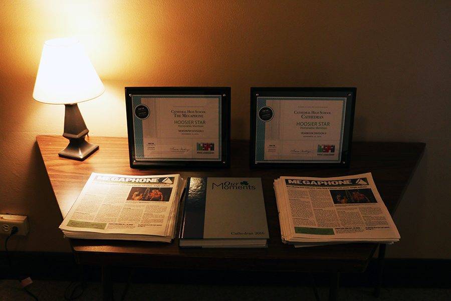 Outside Loretto 2212, Hoosier Star awards for the newspaper and yearbook are displayed.