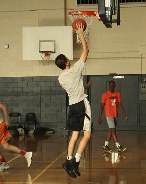 Senior Jack Myers shoots a lay-up in a practice last week in the Aux gym.