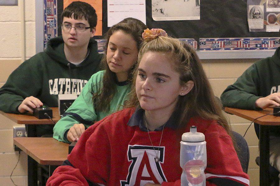 Seniors Rachel Kent and Julia Agostino, junior Liam Moore, and sophomore Sammy Kascius practice for their next competition.
