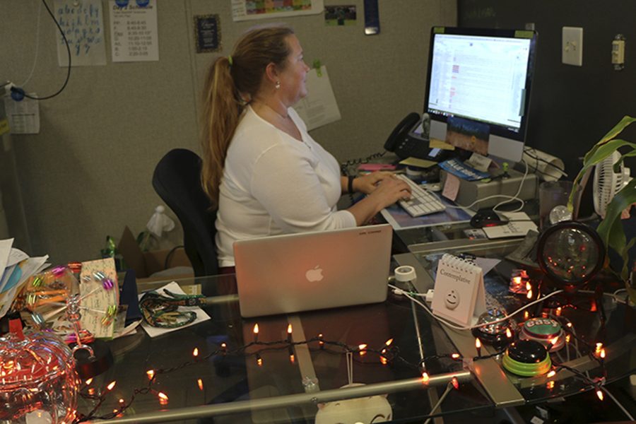 Technology and county coordinator Mrs. Gara Schommer works to prepare for today’s county Christmas celebration.  