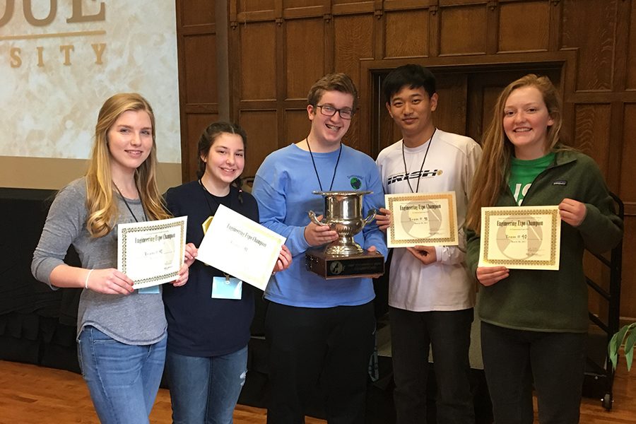 Members of the winning engineering team show off their trophy at Purdue. 