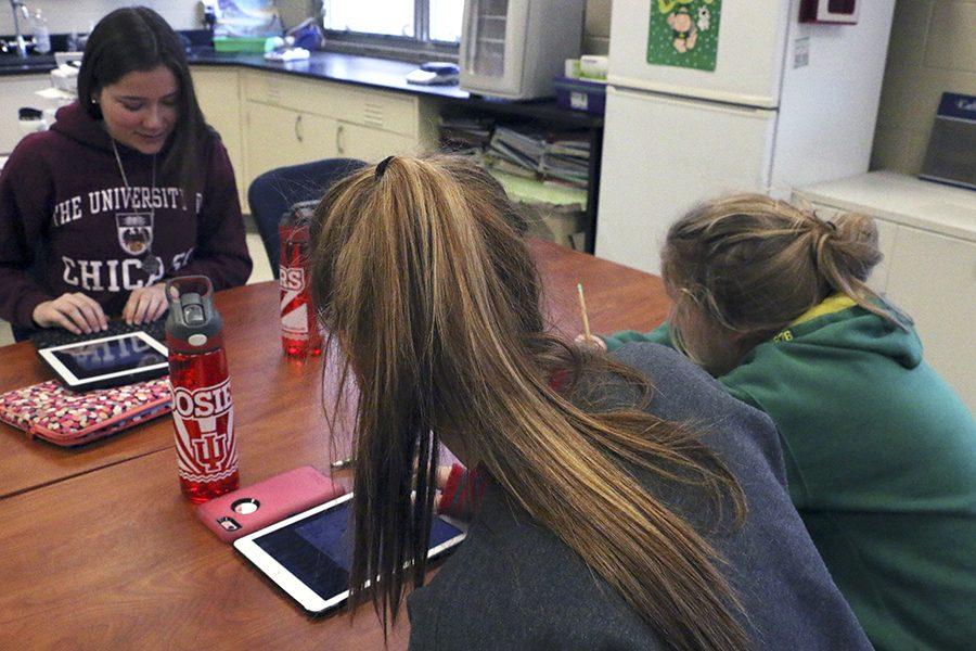 Seniors Emily Getz, Katie Hoffman and Kelly Barry take notes in AP Environmental Science. AP Environmental provides another opportuinity for students to learn new ways to preserve and enhance the environment. 
