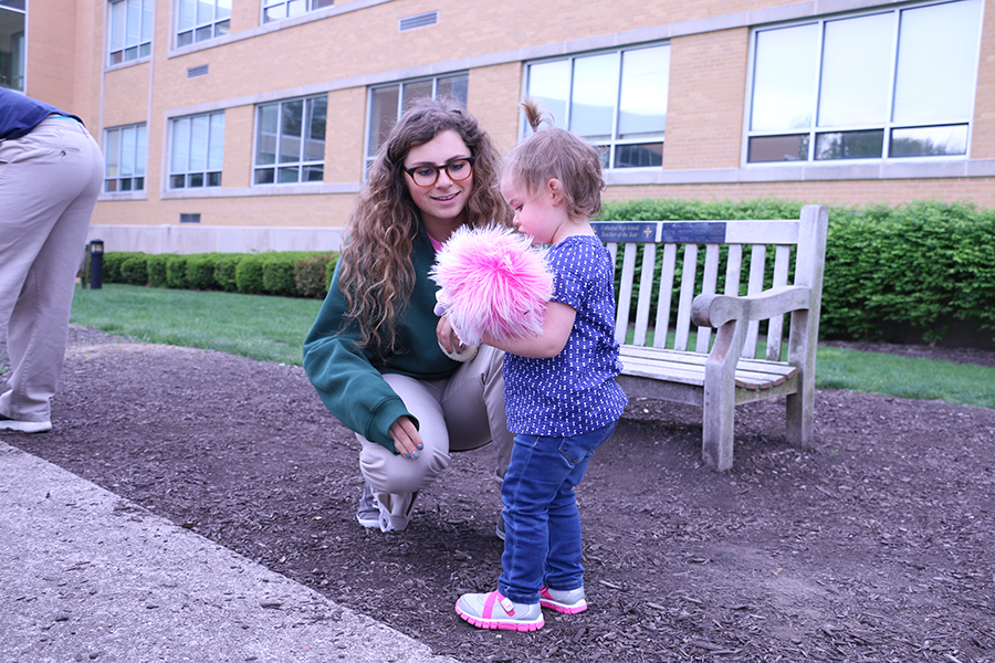 Senior Isabel Cavosie plays with one of the children during the annual AP Psychology daycare.
