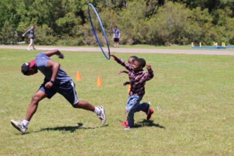 Students set up and participated in a field day at an elementary school on their last full day in South Carolina. 