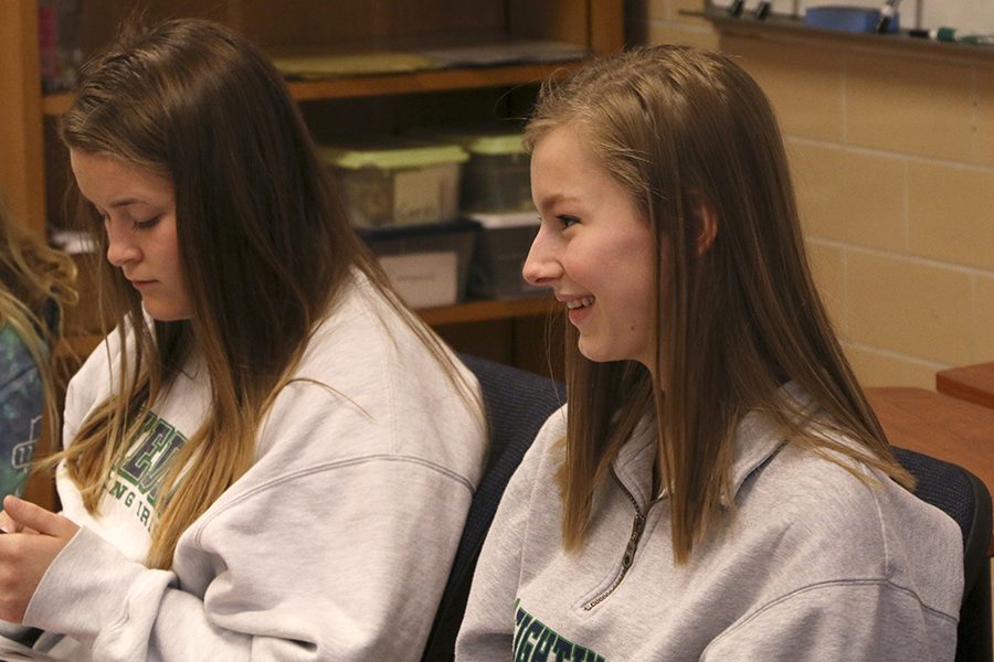 Juniors Hannah Tuttle and Helen Queis talk with other students in their county on Friday March 24 during flex. “(In the U.S.), school is more like a community, more family,” Queis said.