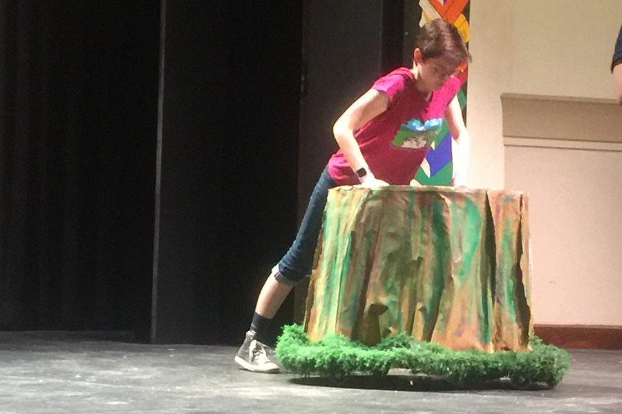 Senior Lillian Moffatt, one of the two student directors, stages a tree stump during the Sept. 21 rehearsal. 