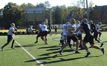 The varsity football team runs a drill during a practice that took place in September. 