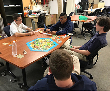 Freshman Hector Perez, sophomores Anthony DeSanto, Ethan Downs and Ethan Emery  
develop their settlements. 