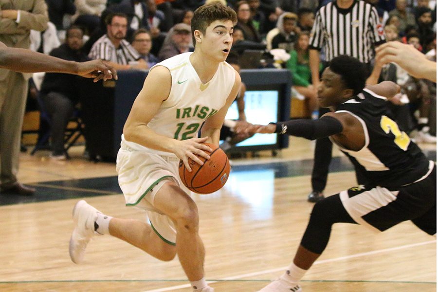 Senior Jacob Ball drives the lane during the Irish win over Howe. 