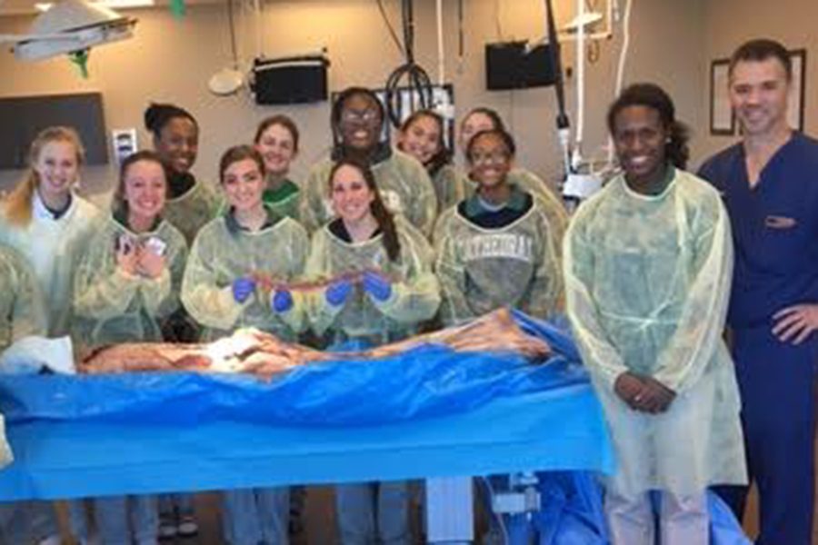 Club members gather after they participated in the dissection of a cadaver. 