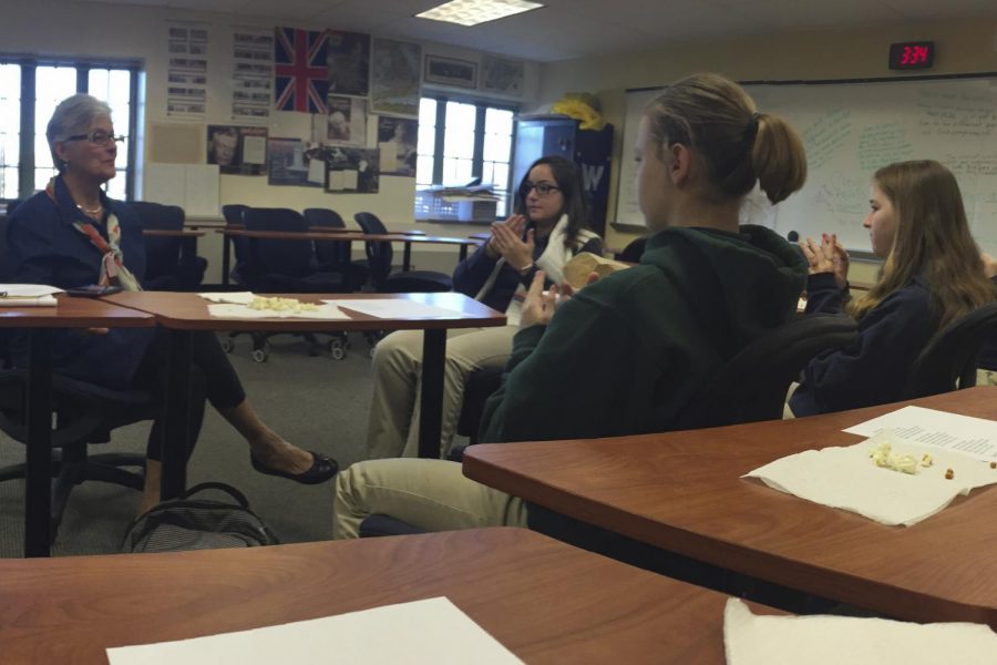 Mrs. Cathy Dezelan instructs members of the ASL Club at a recent meeting.