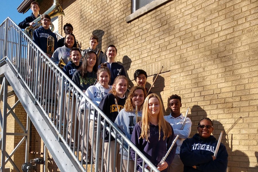 Pride of the Irish members who participated in the state school music contest on Feb. 24 stand on the stairs outside Cunningham. 