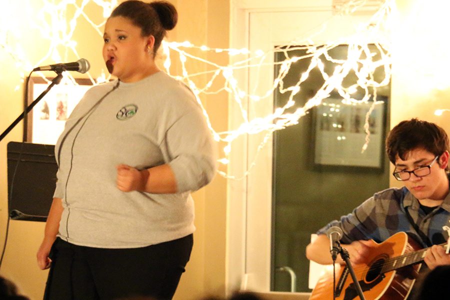 Senior Lauren Graves performs at last years Coffee House Jam, and she will take the stage at this years event on March 9. Evan Schoettle 17 accompanied her. 