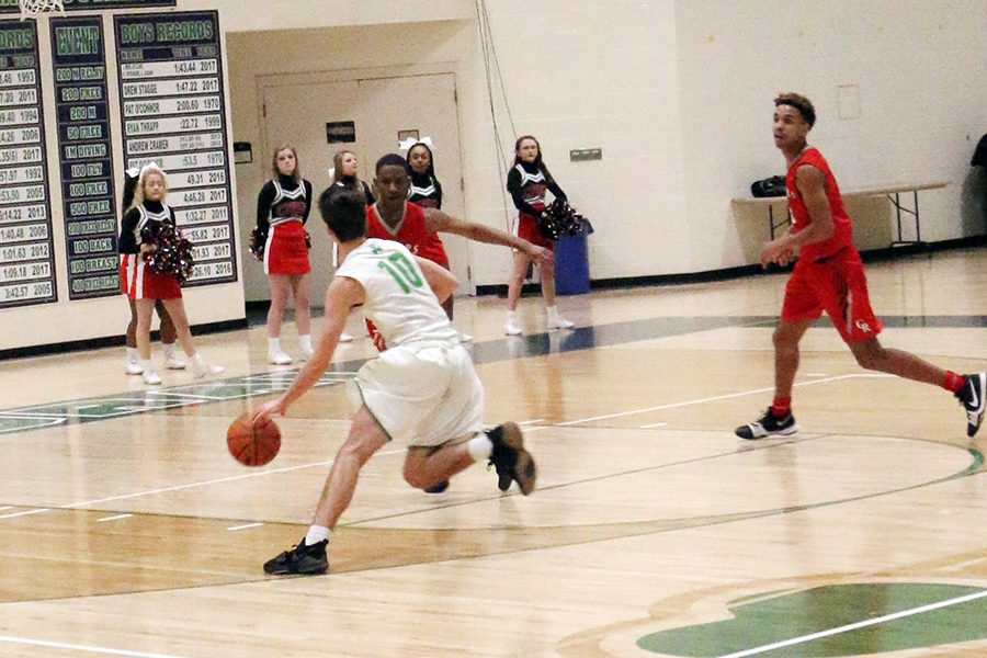 The men's varsity basketball team, shown in action last year, opens the season Nov. 20 against Howe. 