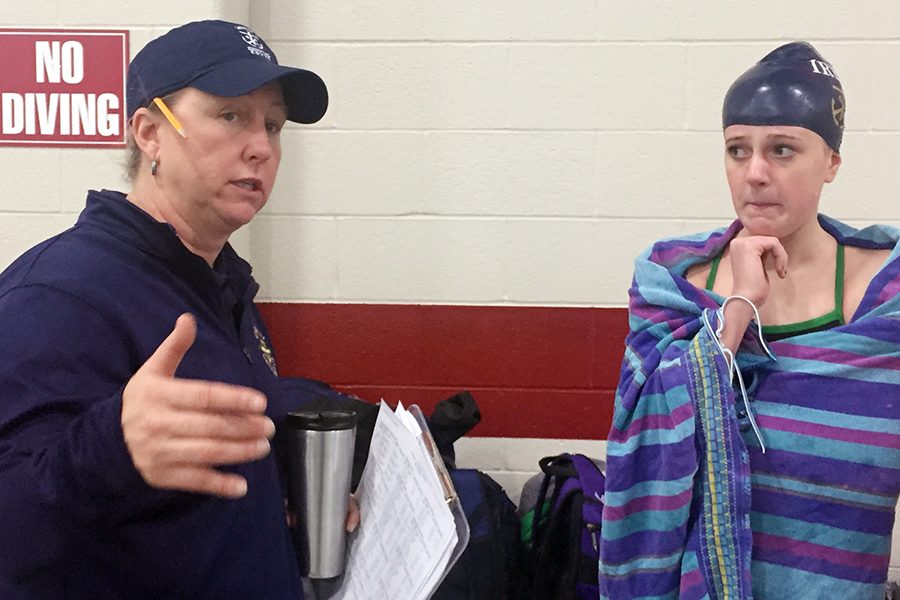 Head Coach Ms. Ashley Hill gives directions during the men's and women's swimming and diving meet Dec. 8 at Southport. 