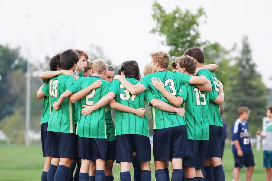 Members of the men's varsity soccer team gather on the pitch during Senior Night just before the match against Roncalli. The starting line-up was all seniors, and 15 players were members of the Class of 2019. Senior leadership was not a problem for Head Coach Mr. Whitey Kapsalis. 