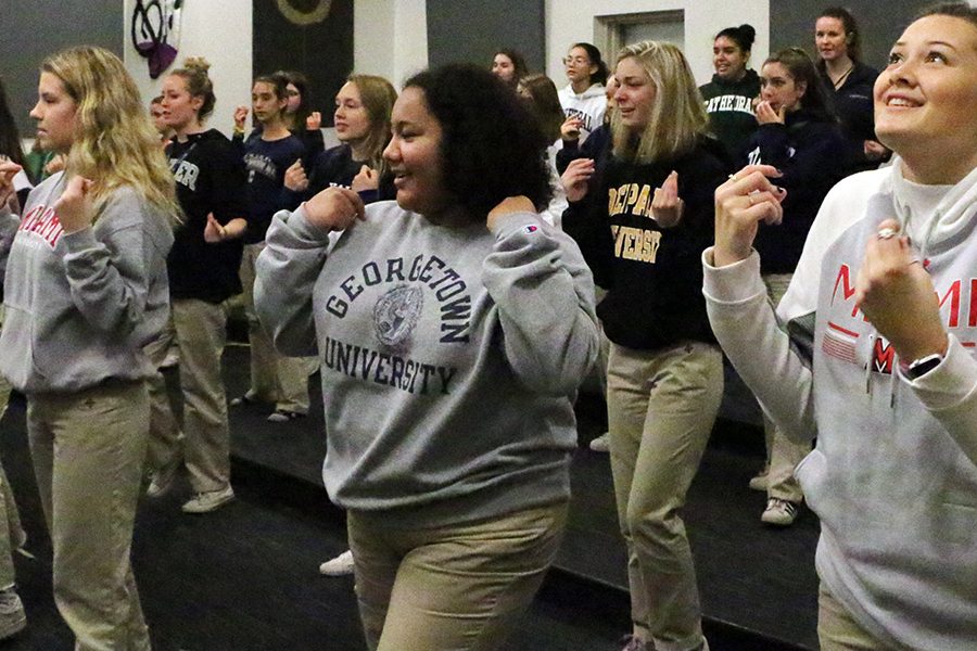 During A period on Nov. 27, choir members practice for the Christmas concert. The choir will spend part of Christmas vacation performing in Rome. 