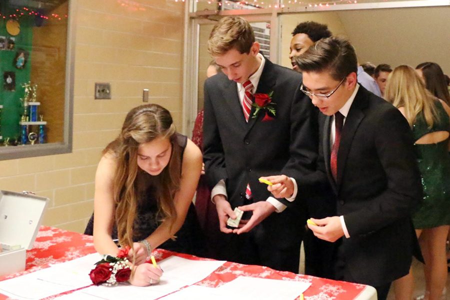 Students signed in at last year's winter formal. The event this year will take place Dec. 8. 