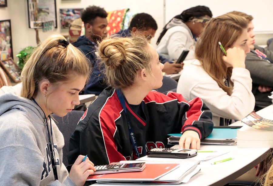 Students hit the books in one of Mrs. Lisa Ford's math classes. 