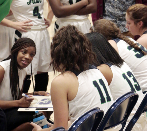 During the regular season game against Lafayette Central Catholic, Head Coach Mrs. Reggen Melson gives directions to her team during a fourth-quarter timeout. 