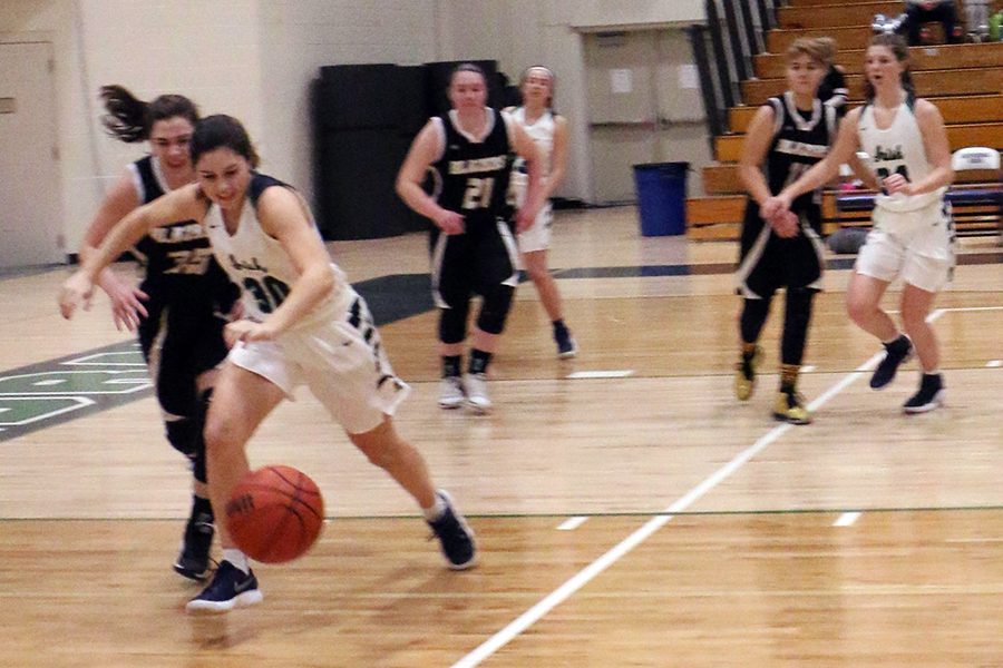 The women's varsity basketball team, shown in action last year, will play Heritage Christian on Jan. 10 in the semifinal round of the City tournament. 