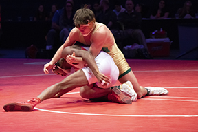 Senior Jordan Slivka wrestles senior Donnell Washington Jr. from Portage on Feb. 17 at Bankers Life Fieldhouse for the 160-pound individual State title. Slivka came from behind in the third period to win, his second consecutive individual State championship. 