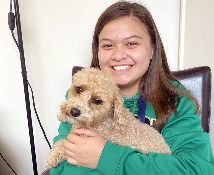 Muffin visits with one of her best friends, senior Emily Sorg. 