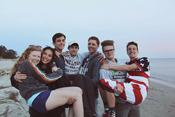 Juniors Gracie Carr and Kylie Price, Will Kennedy and Will Browning and seniors Kiernan McCormick, Tim de Boer and Connor Helman pose on the beach during free time on last year’s spring mission trip to South Carolina. “This trip is a lot of fun because it bonds people closer with the school and people from other grades,” Helmen, who will participate again this year, said.