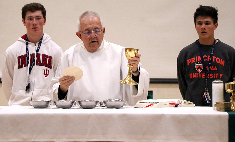 Fr. Jeff Godecker celebrates a school wide Mass last year in the Welch Activity Center. 