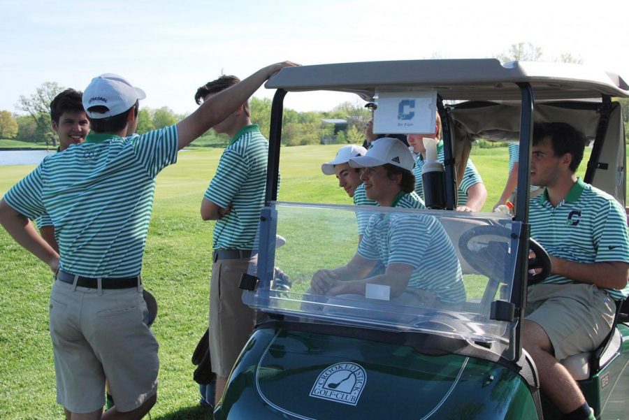 Golf caddies may apply for the Evans Scholarship for tuition at Indiana University or Purdue University. Members of the golf team prepare for the State Finals last season. 