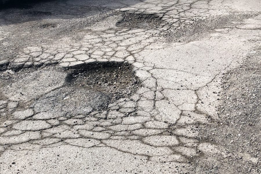 These are among the numerous potholes that will be repaired this summer when then junior lot is repaved. 