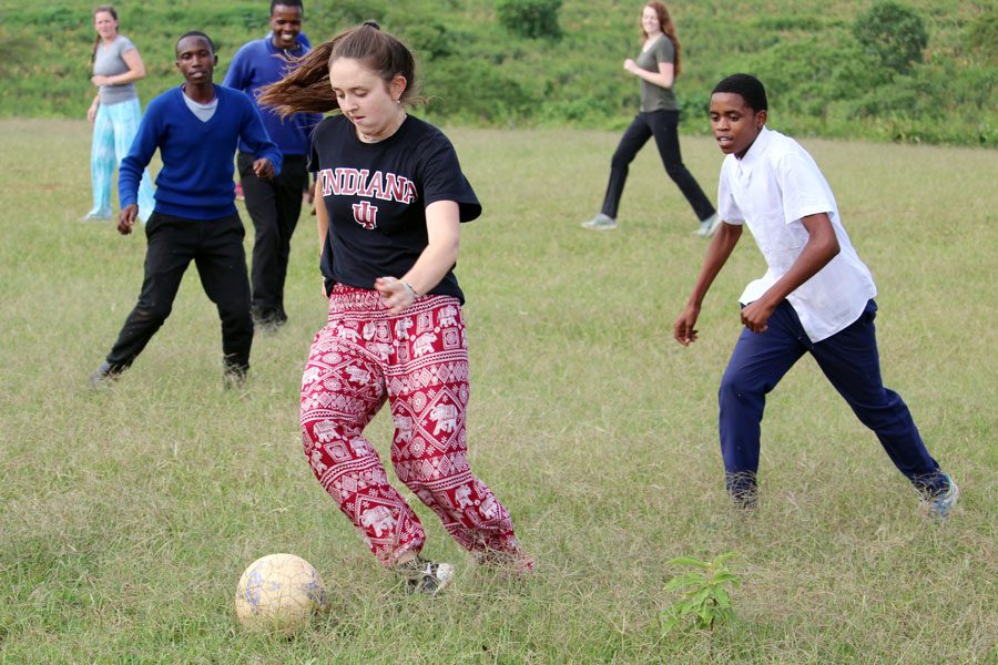 Senior Marcelle Blanchet plays soccer during the In Our Village trip to Africa over the summer. 