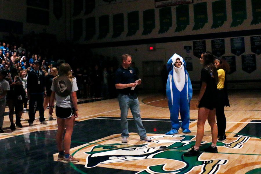 Former Vice Principal Mr. Jere Kubuske returned to campus to help announce the annual winner of the Homecoming spirit stick. He gathered the four class presidents on the basketball court just before the seniors were announced as the spirit stick winners.