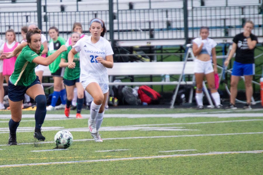 Senior Maddie Wirth advances the ball against Bishop Chatard. The Irish open Sectional play on Oct. 8. 