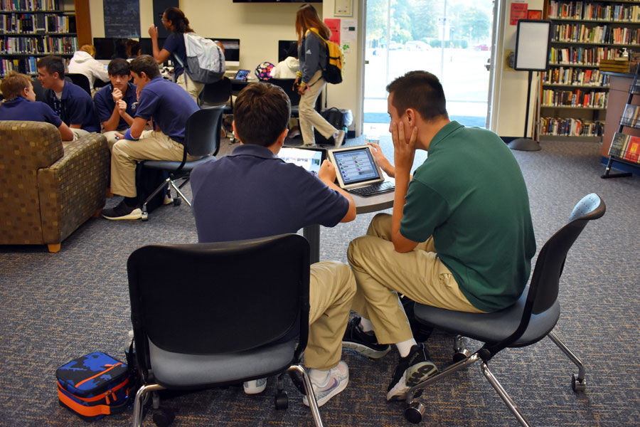 Freshmen gather in the library, a location that will get a workout during the days leading up to final exams. 