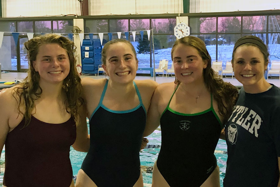 Members of the women's swimming and diving team take a break during a recent practice. 