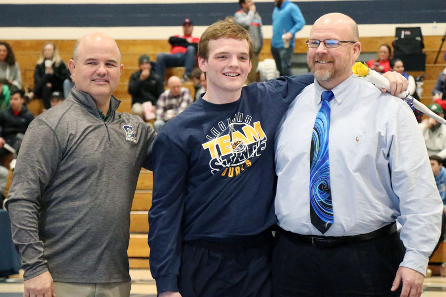 Senior Jacob Huffman, who both wrestles and sings in the choir, is recognized at Senior Night on Jan. 22 in the Welch Activity Center. 