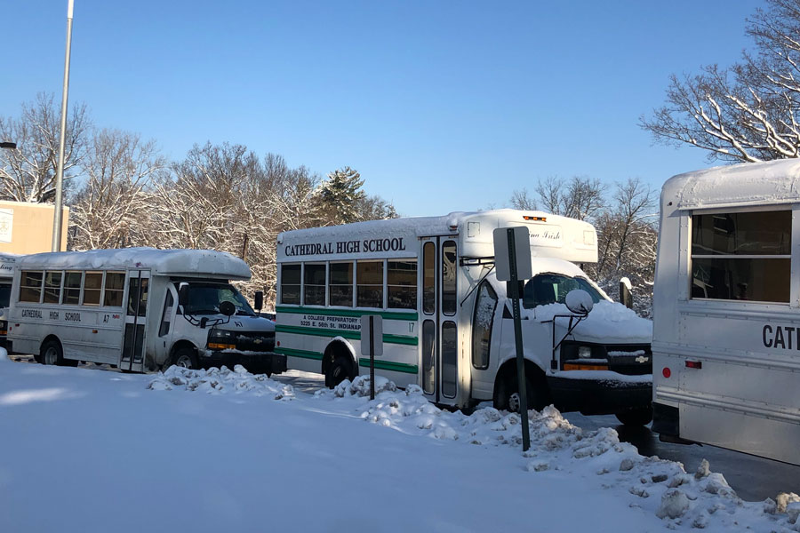 In December, buses line up on the traffic circle, ready to transport students to their homes. 