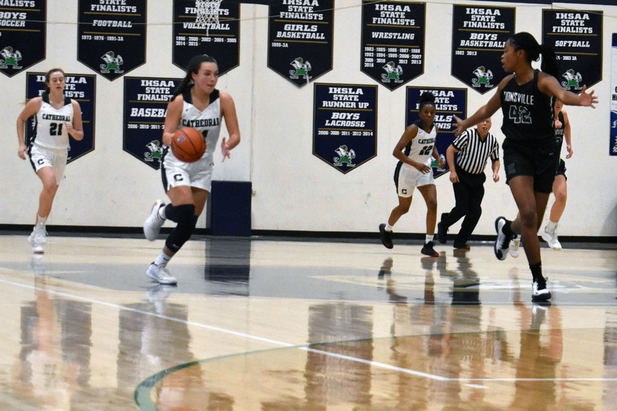 Senior Cassie Piper brings the ball up the court during a recent home game. 