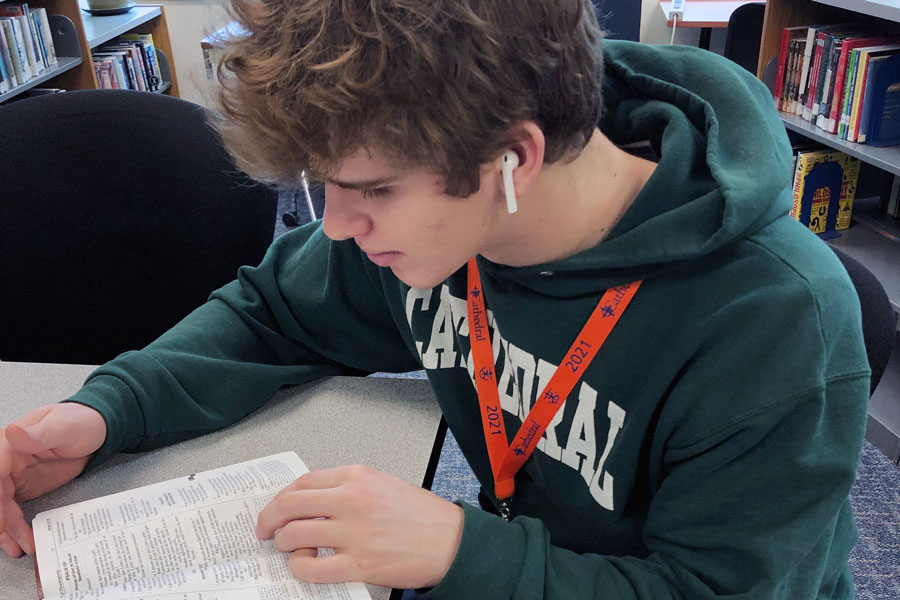 In the library during E period on Jan. 21, junior Nathan McCahill takes time out to read. 