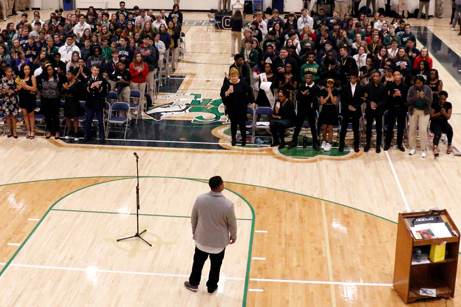 Mr. Eric Saunders '01 addresses the student body at the Feb. 12 Black History Month assembly. 