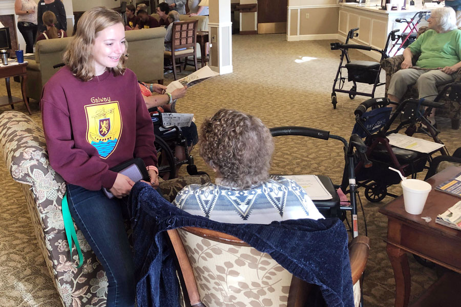 As part of her county's activities on the day of service in September, senior Kaylor Jasiak visited with a resident of a local senior citizen residence. 