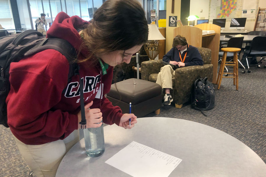 Senior Anna Tobias signs in during her G period resource on Feb. 24. 