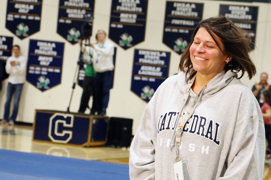 English teacher Mrs. Jennifer Neale reacts to being named one of two Holy Cross award winners at the Jan. 31 Winterfest assembly. 