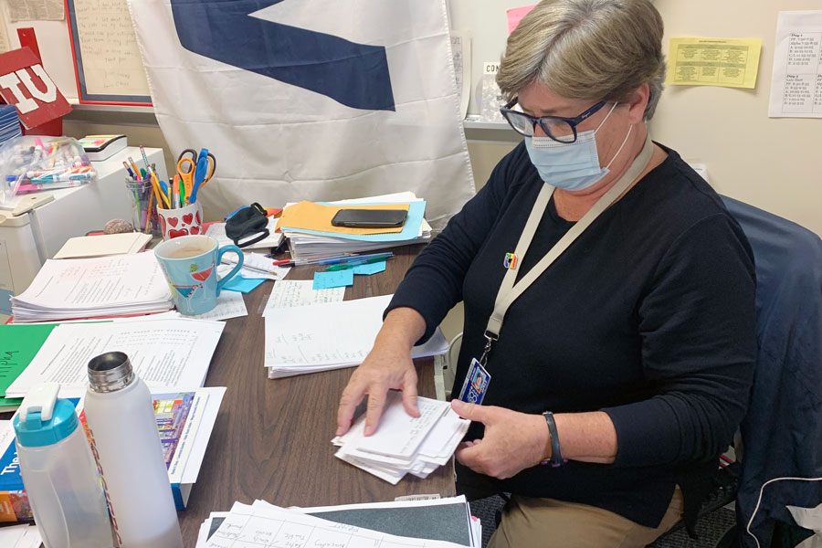 English teacher Ms. Laurie O'Brien works in her classroom on the second floor of Loretto Hall. 