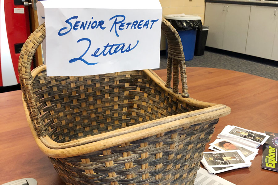 A basket in the faculty workroom in Kelly Hall provides teachers a place to drop off letters to senior retreat participants. 