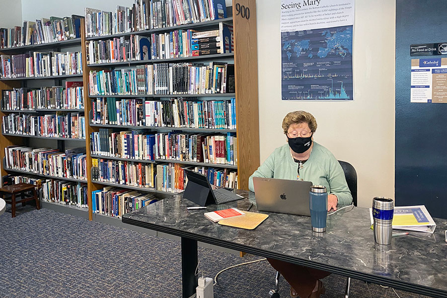 Sr. Mary Mary Ann Stewart prepares for her next social studies class in the library. 