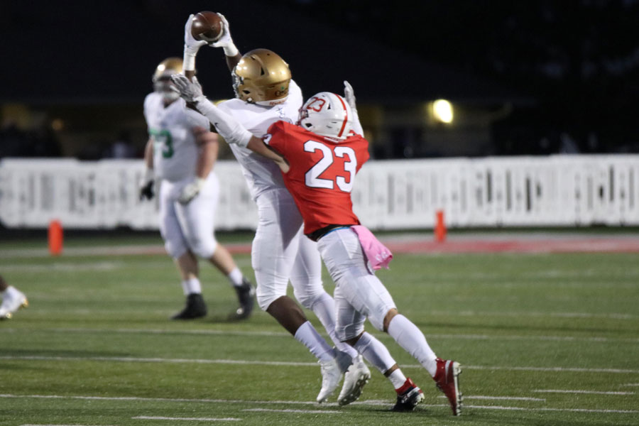 Senior David Perry hauls in a pass during the regular season game against Center Grove. 