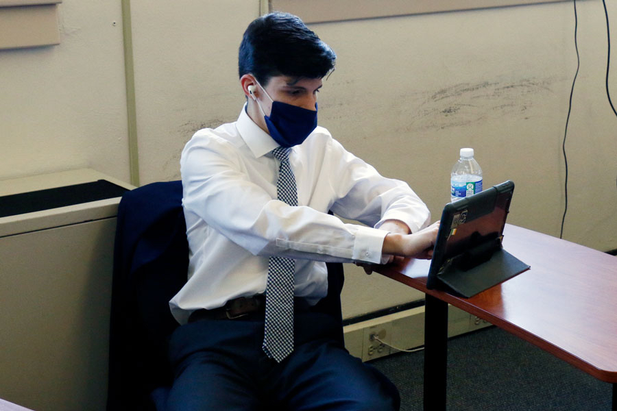 Dressed up for both school pictures and Election Day, senior Eric Dickey casts his vote in the mock election during B period on Nov. 3.