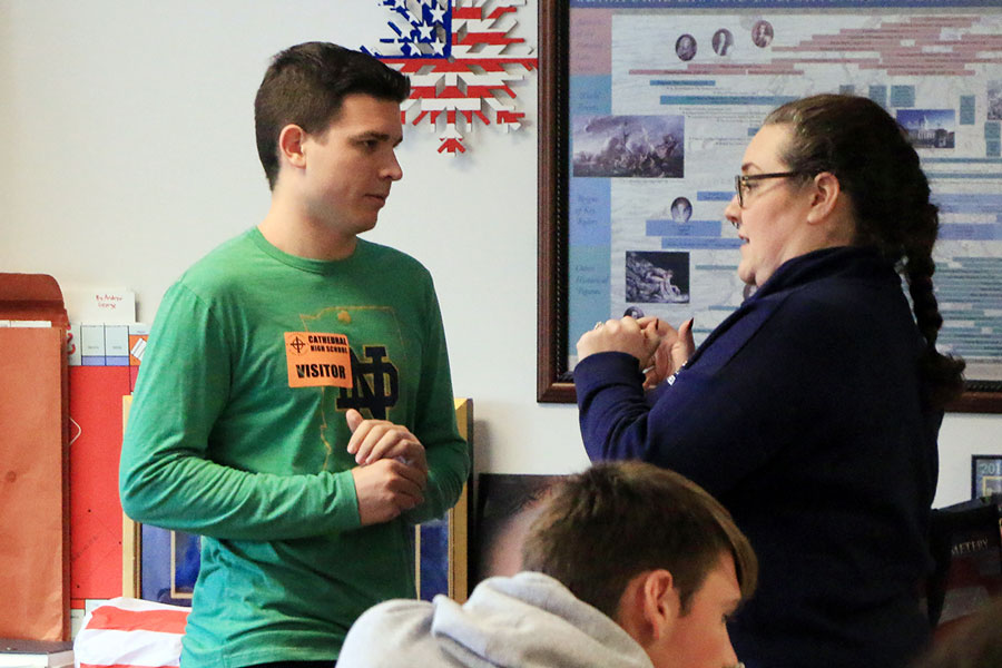 Social studies teacher Mrs. Jill Twilleager talks to former We the People team member Stephen Vukovits during one of his post-graduation visits to campus. Twilleager explained the Electoral College and why the person who receives the most votes for President is not necessarily the candidate who takes office. 
